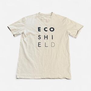 Shield apparel beige small size (width 19in, length 24/2in) graphic T shirt
